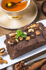 Chocolate cupcakes with mint on wooden table