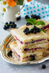 Homemade baking. Cookies with black currant jam on a gray stone or slate background.