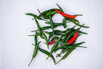 Red and green pepper in a stone mortar.