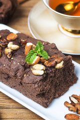 Chocolate cupcakes with mint on wooden table