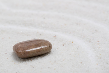 Zen sand stone garden Japanese meditation relaxation and spa image spiritual balance round rock background.