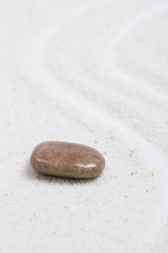 Zen sand stone garden Japanese meditation relaxation and spa image spiritual balance round rock background.