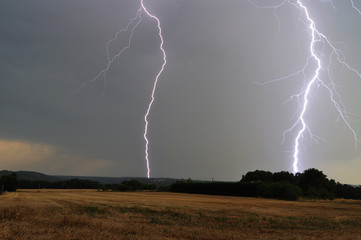 Close lightning strikes in the forest and the valley (Dordogne, France)