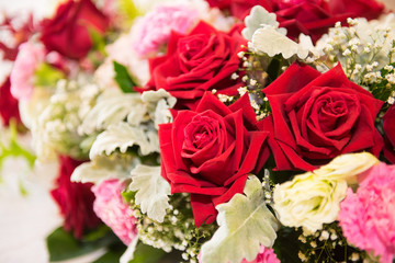 Red and white roses bouquets at weddings and celebrations, copy space.