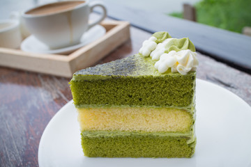 green tea cake with coffee breakfast set in outdoor restaurant