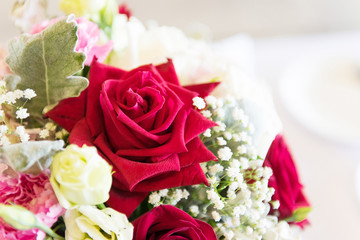 Red and white roses bouquets at weddings and celebrations, copy space.