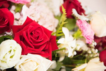 Red and white roses bouquets at weddings and celebrations, copy space.