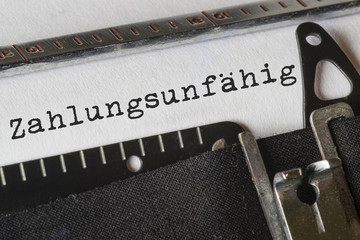 zahlungsunfähig, Text Schreibmaschine
