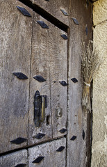 Old medieval wooden door with lock