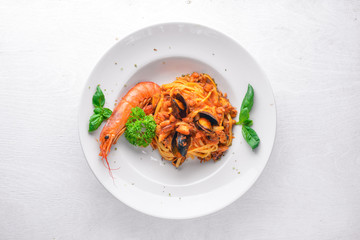 Seafood Pasta. Mussels, shrimp. On a wooden background. Top view. Free space for your text.