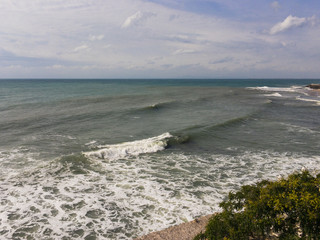 Rough and choppy sea with waves and cloudy sky
