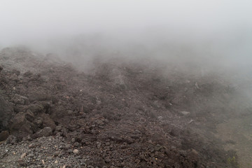 Lava flow of the Pacaya volcano in the mist, Guatemala