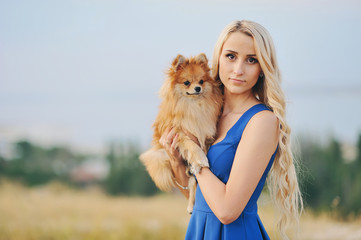 Lovely portrait of the blonde with a red doggie