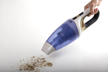 Cleaning bread crumbs with a portable vacuum cleaner