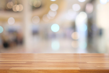 Empty wooden table and blur interior background