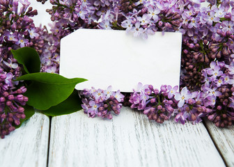 Lilac flowers with empty tag