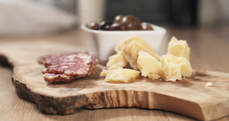 italian antipasti appetizers on olive board