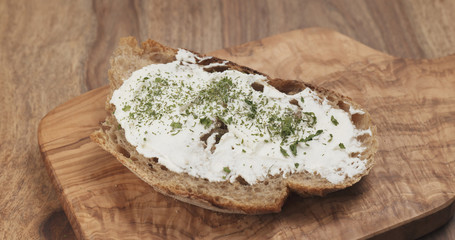 herbs on rustic bread with ricotta cheese
