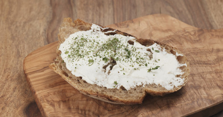 herbs on rustic bread with ricotta cheese