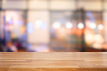 Empty wooden table and blurred  modern kitchen cafe background