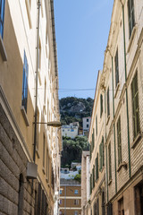 Fototapeta na wymiar Rock of Gibraltar Through Alley