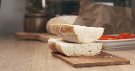 sliced in half ciabatta on cutting board
