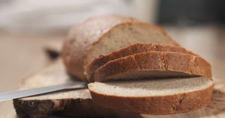 slices of rye wheat rustic bread on cutting board