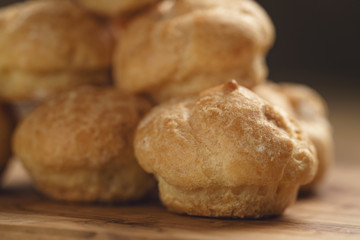 profiteroles on olive board macro