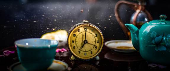 Alarm clock on the tea table