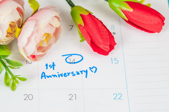 word anniversary celebration plan on calendar with flower