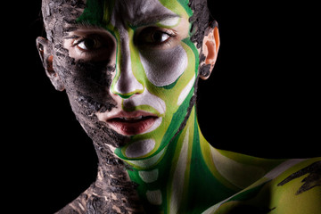 Woman with conceptual make-up in artistic shadows in studio photo. Extreme beauty image