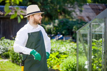 portrait of a smiling greenhouse worker