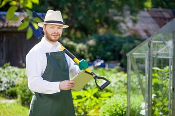 portrait of a smiling greenhouse worker