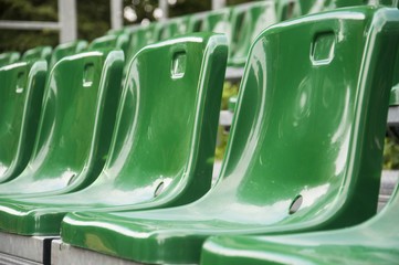 green fan chairs on the stadium
