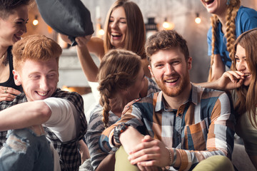 Group of four friends laughing out loud outdoor, sharing good and positive mood