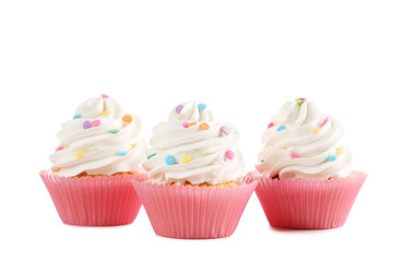 Tasty cupcakes isolated on a white