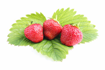 Fresh strawberries with green leaf isolated on white background
