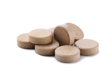Brown pills isolated on a white background