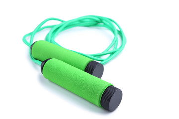 Green skipping rope isolated on a white background