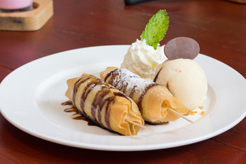 Banana Stick Served with Vanilla ice cream and wipping cream