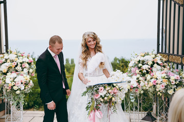 Bride and groom sign for the wedding ceremony