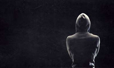 Silhouette of man in hoody
