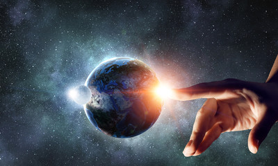 Touching planet with finger