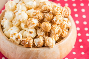 Close up, Caramel popcorn in wood bowl.