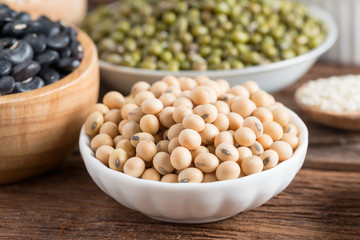 Soy bean, Red bean, Green bean on wood background.