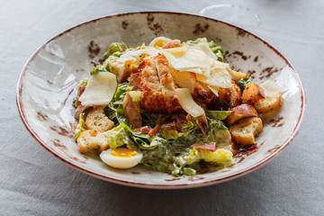 Caesar salad in a round plate
