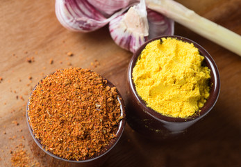 Spices and herbs in ceramic bowls. Food and cuisine ingredients. Colorful natural additives.