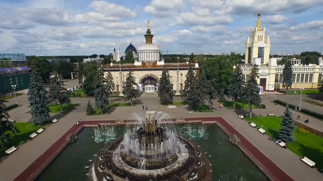 View Over the Top of Historical Building Complex. Pond at Square With Fountain. Fir Trees. Green Park. Mosque. City Skyscryper on Background. Summer