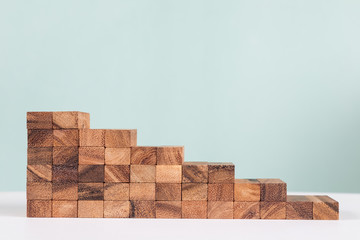 Wooden block stacking as staircase level, business growth concept