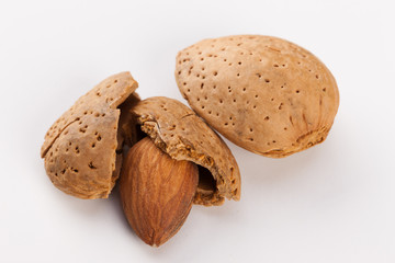 Whole almonds nuts isolated on white background